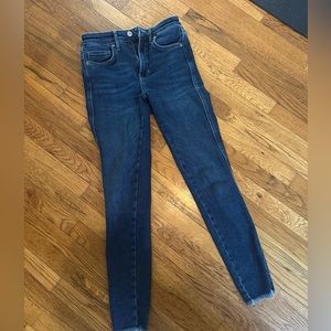 Free people skinny jeans with frayed bottom. Never worn